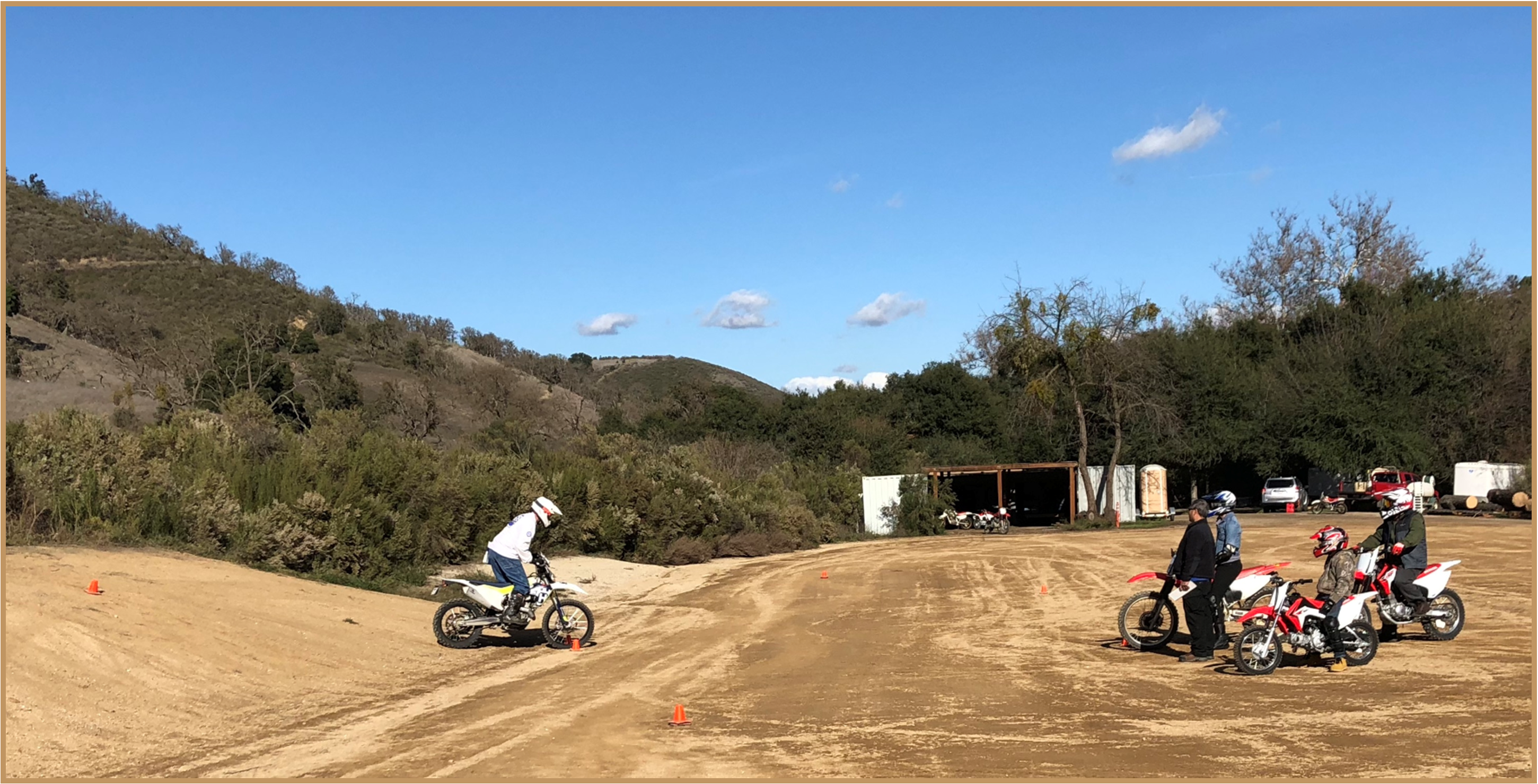 instructor on motorcycle in front of class